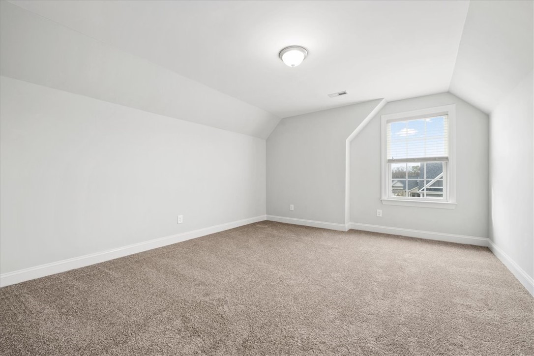 102 Ripplestone Way Anderson, SC 29621 - Photo 29 of 39 A spacious room offers ample space, illuminated by natural light from the window.