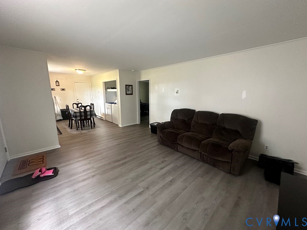 477 White Hall Road Keysville, VA 23947 - Photo 12 of 12 a living room with furniture and wooden floor