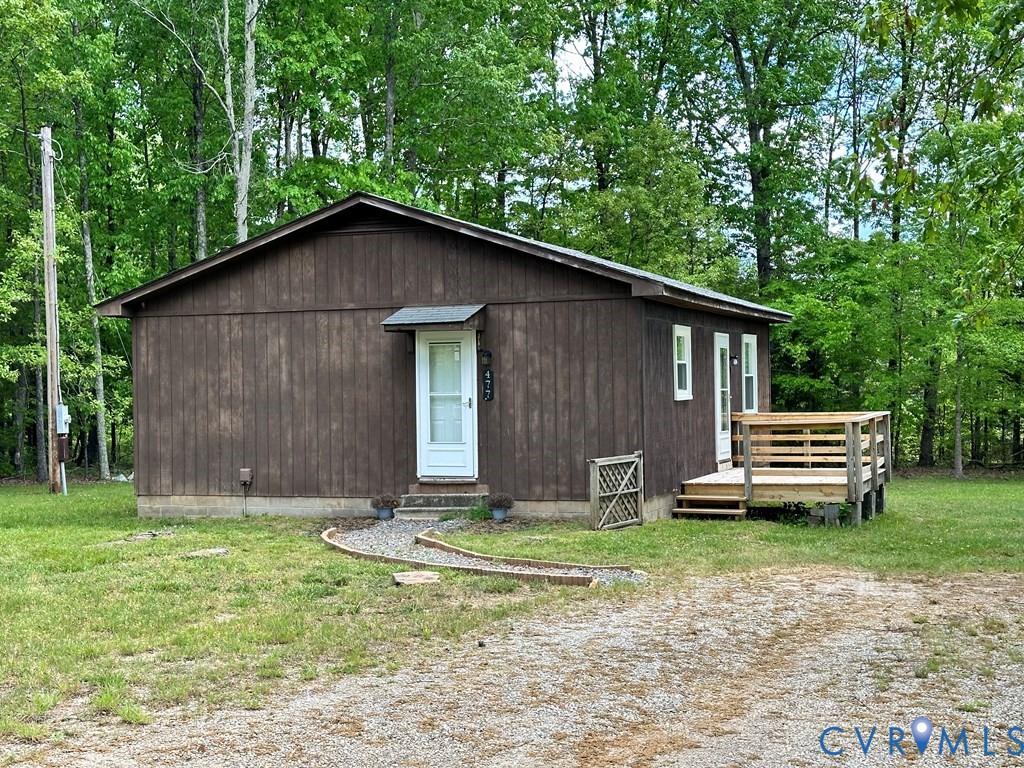 477 White Hall Road Keysville, VA 23947 - Photo 2 of 12 a backyard of a house with garden and barbeque oven