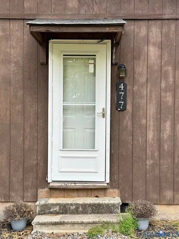 a bedroom with two beds and a window
