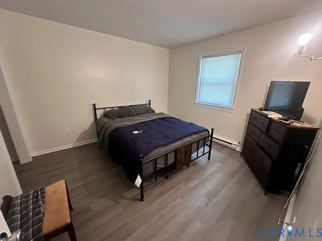 a kitchen with a refrigerator a table and chairs