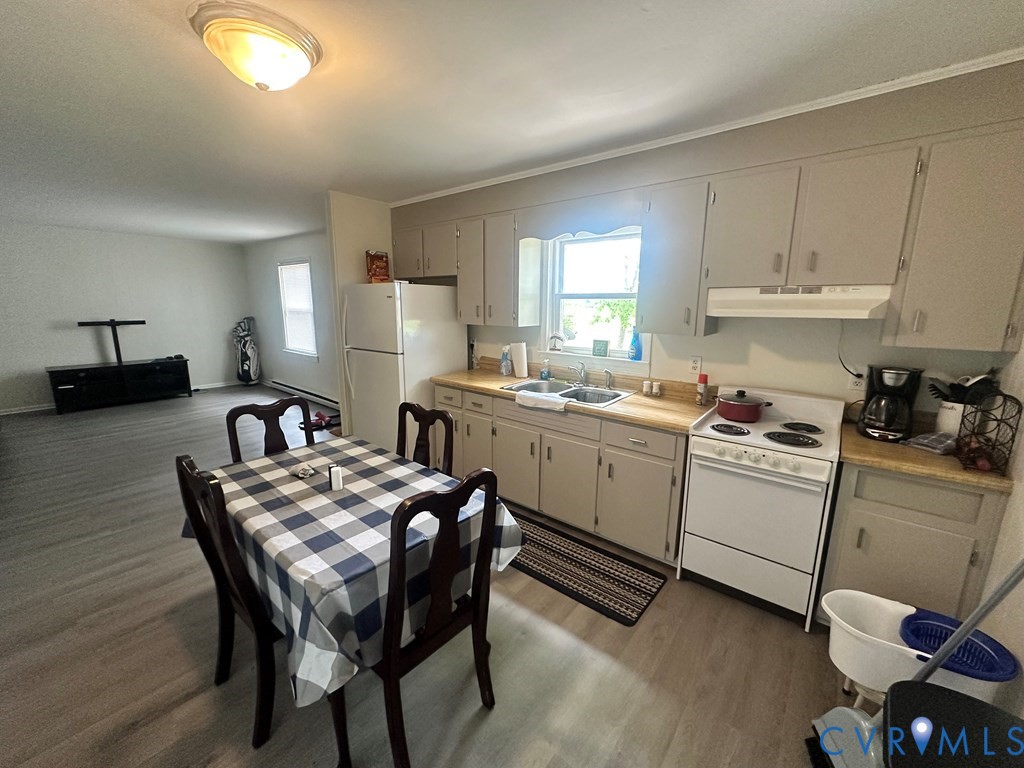 477 White Hall Road Keysville, VA 23947 - Photo 10 of 12 a kitchen that has a microwave a sink and a stove in it