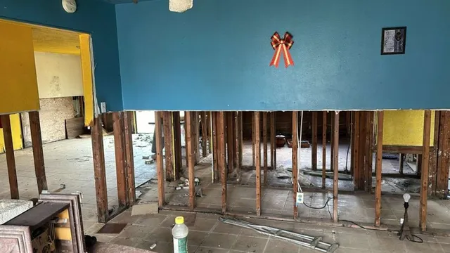 a view of hall way with furniture