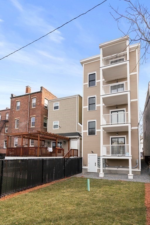 134 Chelsea Street, Unit 1 Boston, MA 02128 - Photo 9 of 13 a large building with a swimming pool