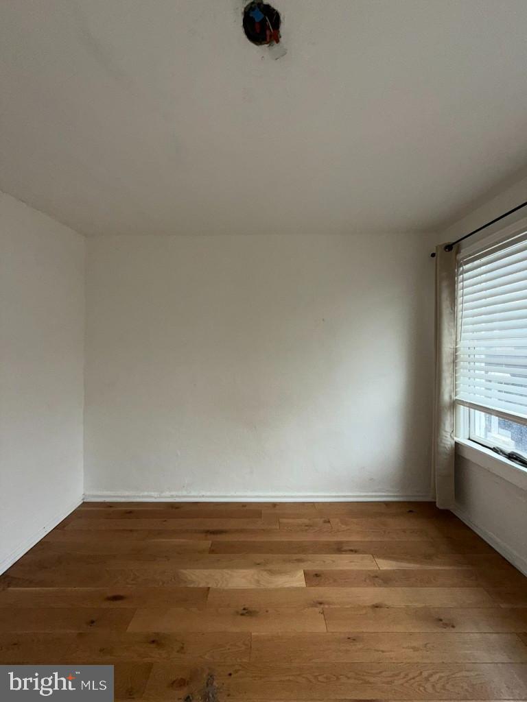 1607 Lemmon Street Baltimore, MD 21223 - Photo 15 of 30 a view of an empty room and window