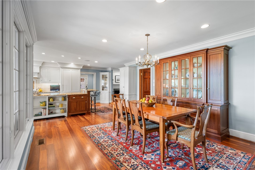 10320 Cherokee Road Richmond, VA 23235 - Photo 15 of 49 a view of a dining room with furniture window and wooden floor