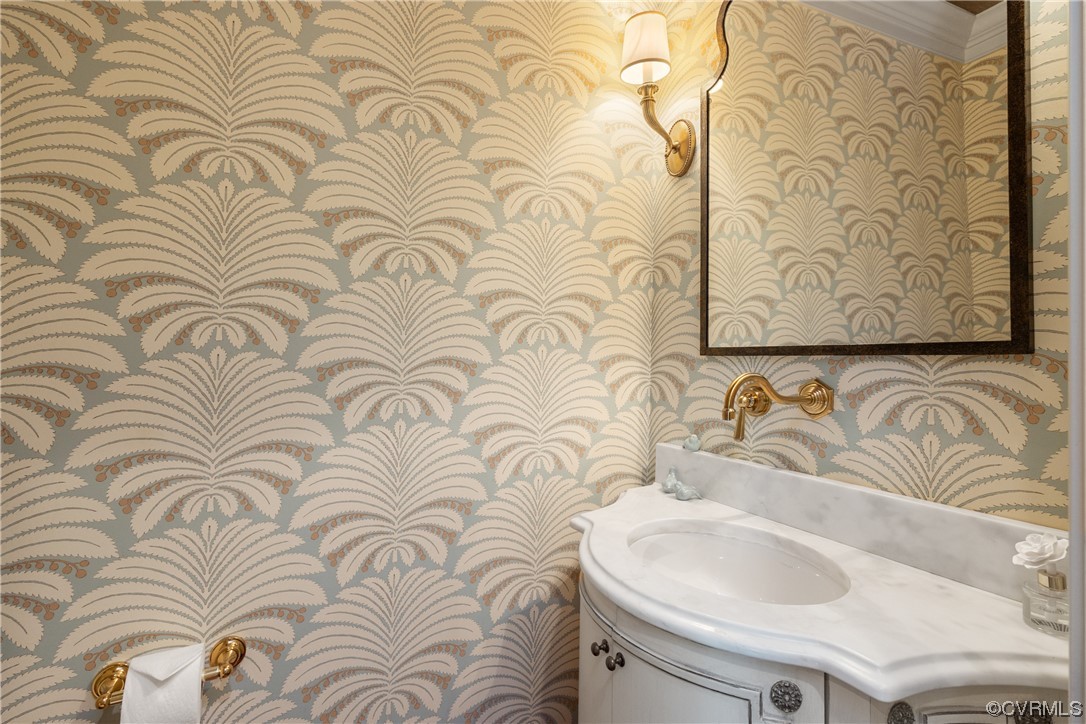10320 Cherokee Road Richmond, VA 23235 - Photo 22 of 49 a bathroom with a sink and a mirror