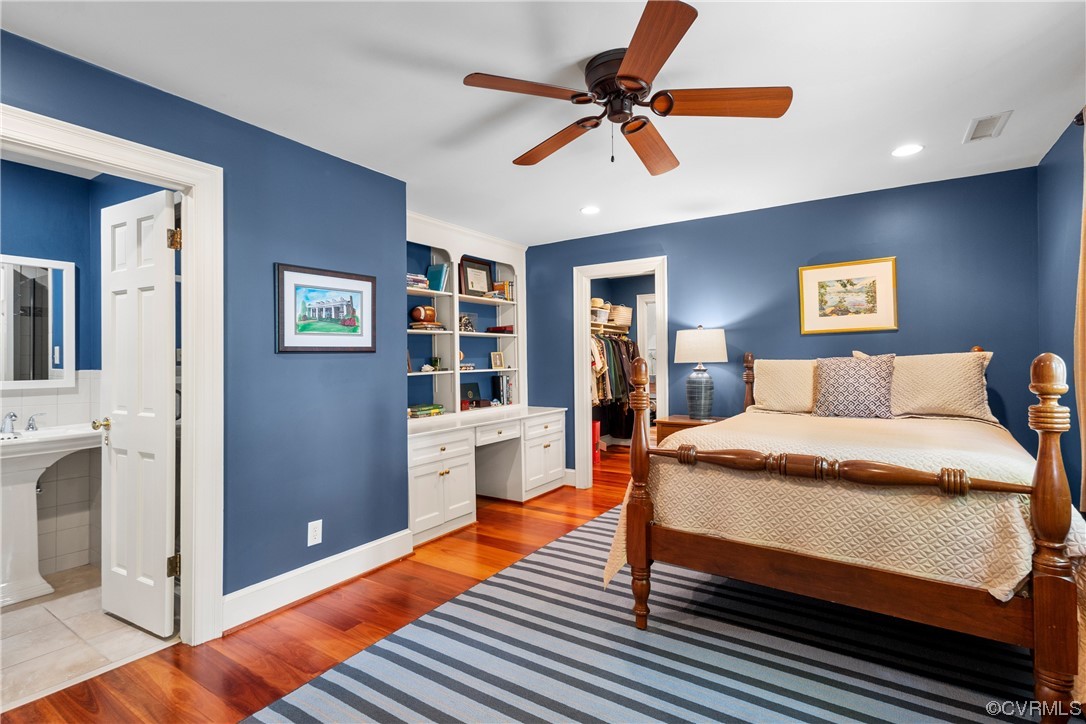 10320 Cherokee Road Richmond, VA 23235 - Photo 24 of 49 a bedroom with a bed and a chandelier