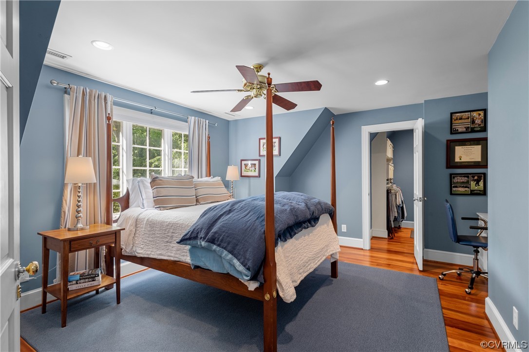 10320 Cherokee Road Richmond, VA 23235 - Photo 27 of 49 a bedroom with a bed and a chandelier