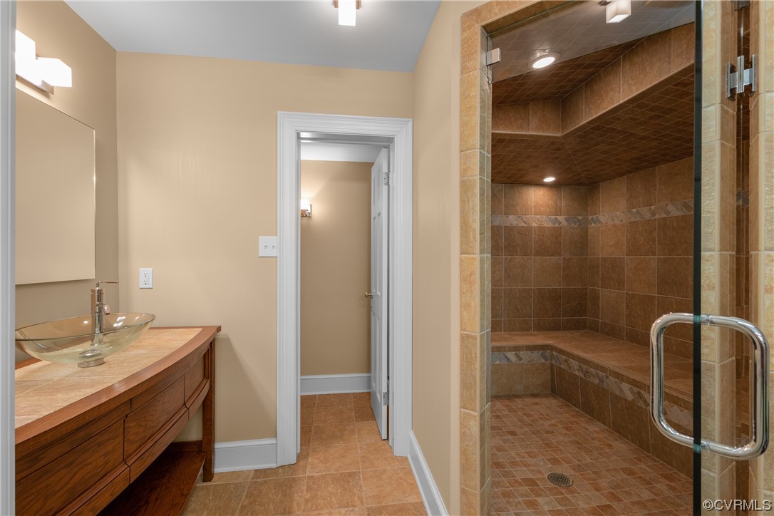 10320 Cherokee Road Richmond, VA 23235 - Photo 41 of 49 a bathroom with a sink a toilet and shower