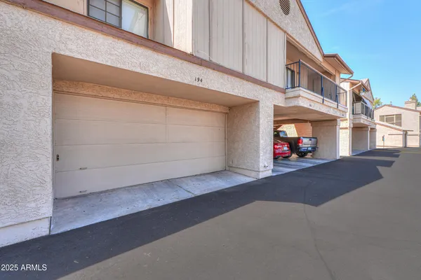 a view of a street with garage