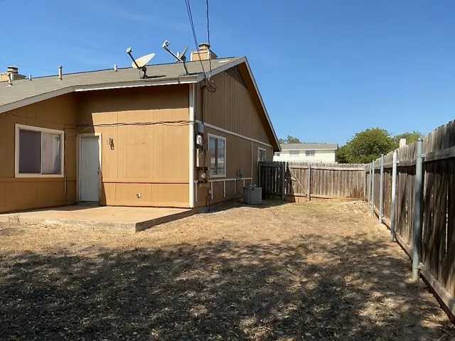 a house with yard in front of it