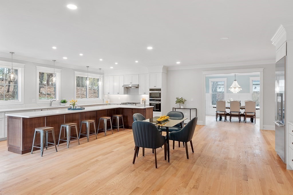 4 Mill Brook Road Lexington, MA 02420 - Photo 11 of 42 a view of a dining room with furniture window and wooden floor