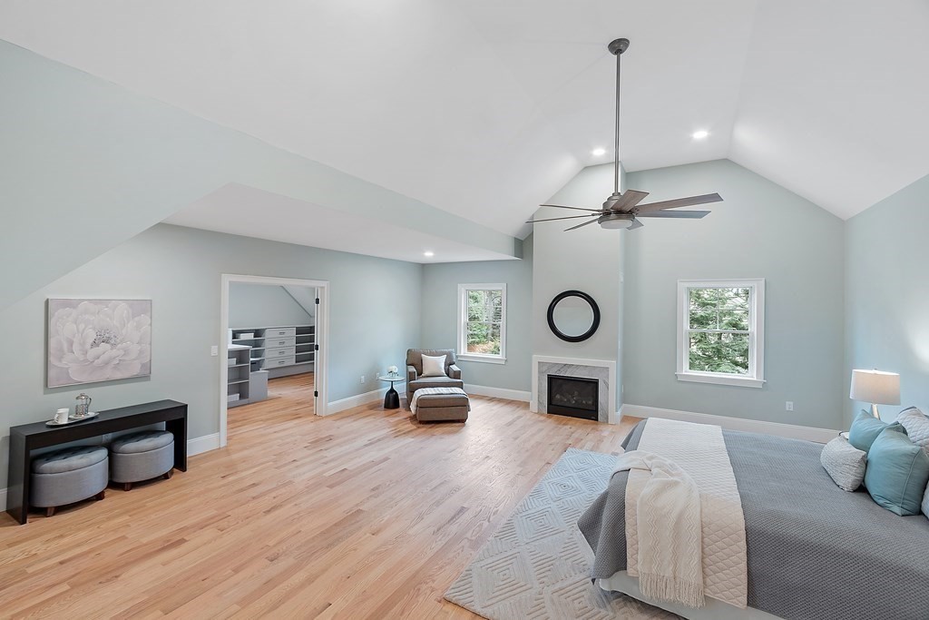 4 Mill Brook Road Lexington, MA 02420 - Photo 20 of 42 a living room with furniture wooden floor and a fireplace
