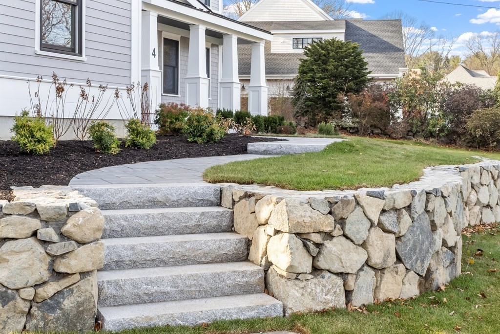 4 Mill Brook Road Lexington, MA 02420 - Photo 2 of 42 a view of a house with a yard and flower plants