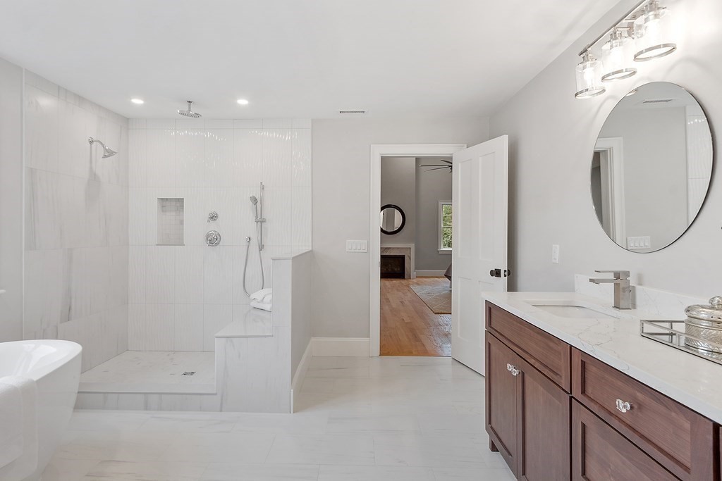4 Mill Brook Road Lexington, MA 02420 - Photo 25 of 42 a spacious bathroom with a double vanity sink toilet mirror and bathtub