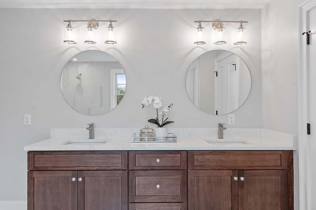 4 Mill Brook Road Lexington, MA 02420 - Photo 28 of 42 a bathroom with double vanity sinks and a mirror