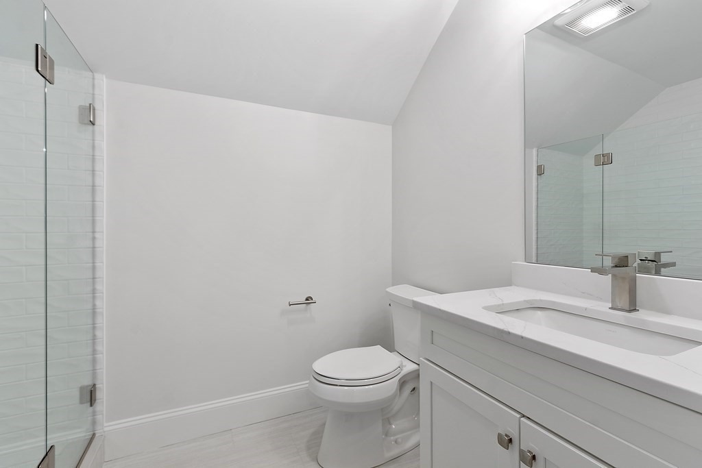 4 Mill Brook Road Lexington, MA 02420 - Photo 33 of 42 a bathroom with a sink a toilet and shower