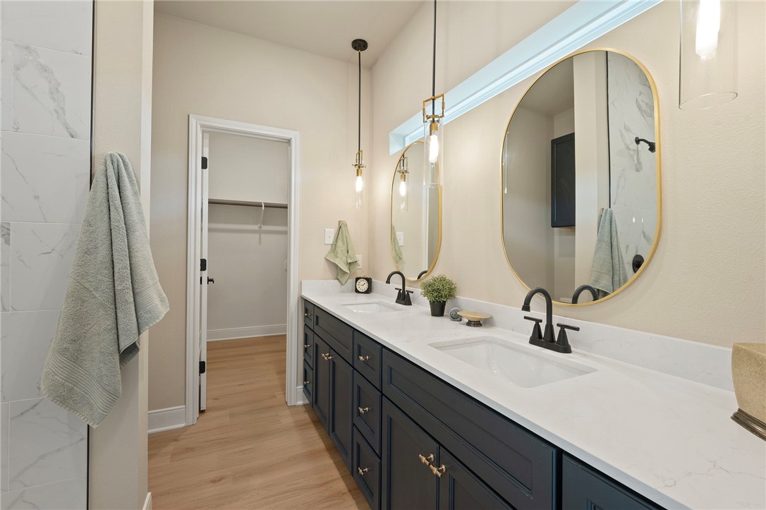 804 East 27th Street Bryan, TX 77803 - Photo 18 of 21 a bathroom with a double vanity sink mirror and shower