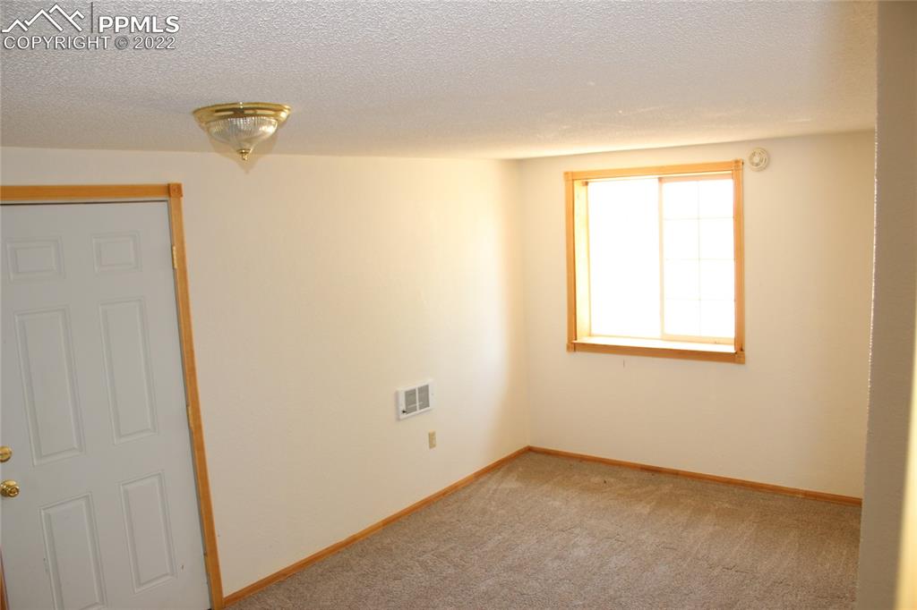 11905 Paint Mine Road Calhan, CO 80808 - Photo 12 of 35 a view of a small space with a window
