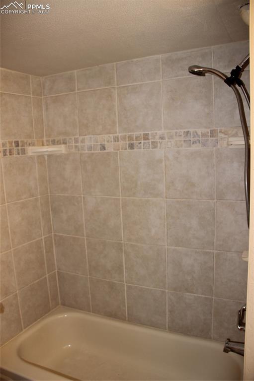 11905 Paint Mine Road Calhan, CO 80808 - Photo 17 of 35 a bathroom with a shower and a bathtub