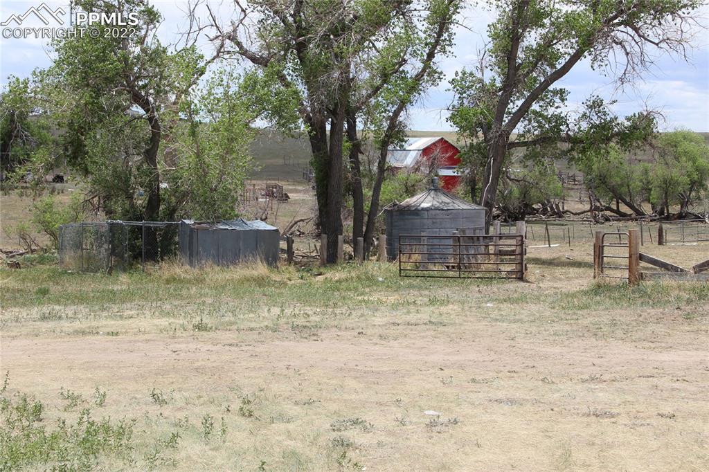 11905 Paint Mine Road Calhan, CO 80808 - Photo 29 of 35 a backyard of a house with lots of green space