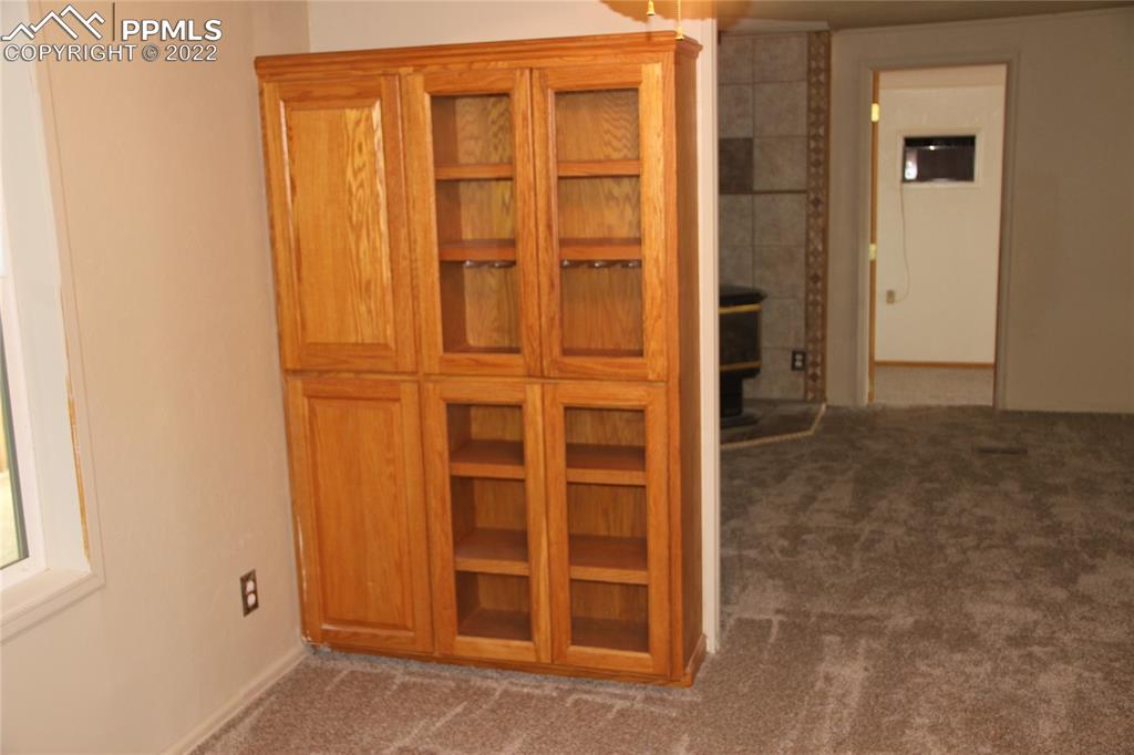 11905 Paint Mine Road Calhan, CO 80808 - Photo 8 of 35 an empty room with windows