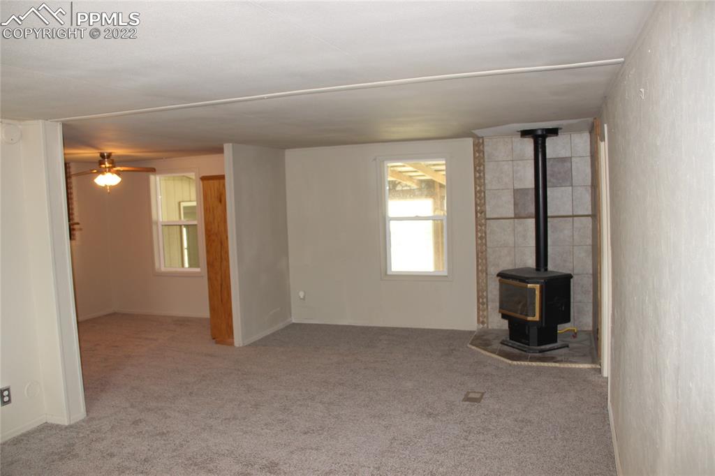 11905 Paint Mine Road Calhan, CO 80808 - Photo 10 of 35 an empty room that has a window