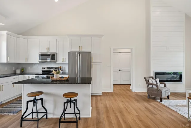 a kitchen with stainless steel appliances a refrigerator and microwave