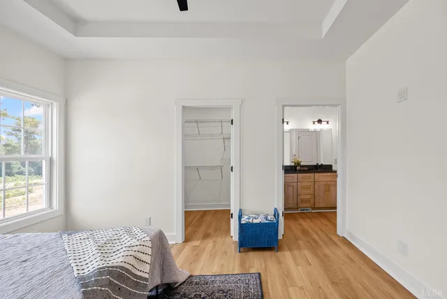 a bedroom with bed and window