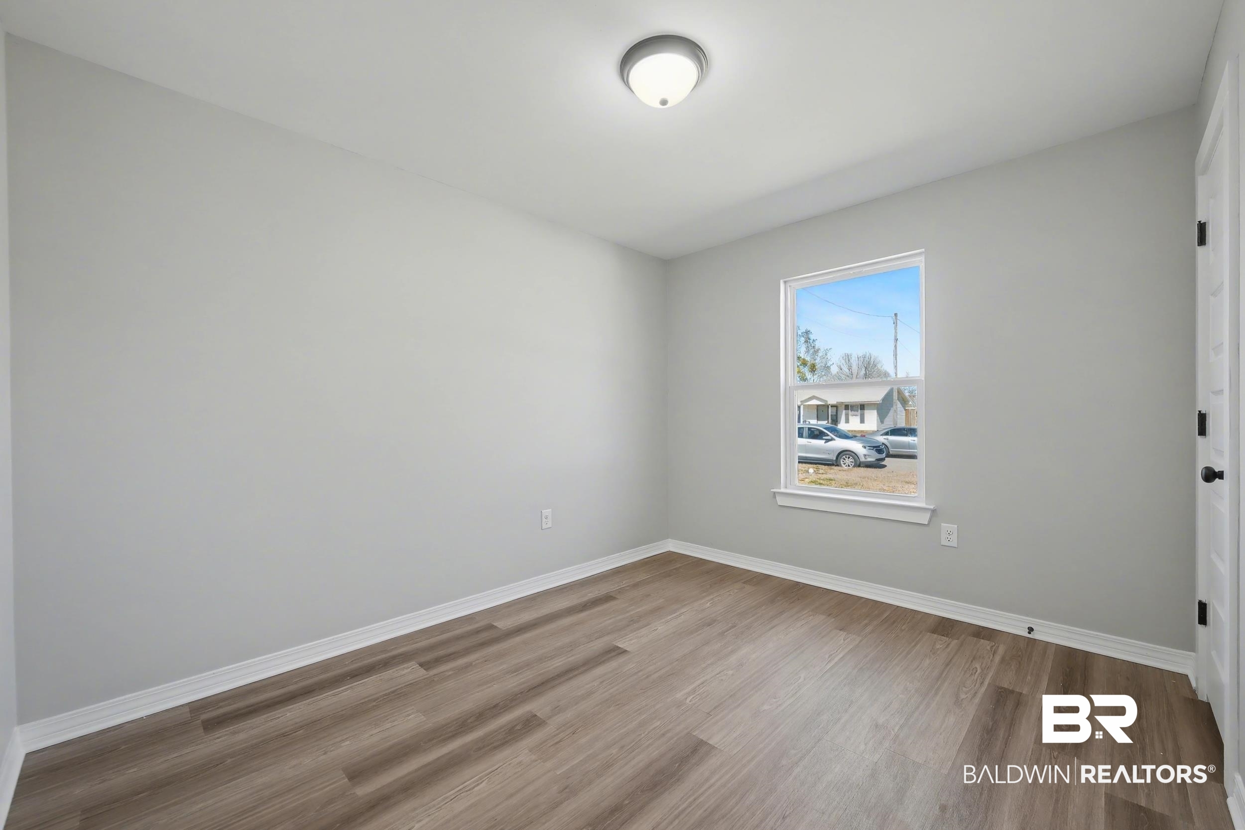 76 Fincher Lane Loxley, AL 36551 - Photo 24 of 33 Unfurnished room with light wood-type flooring and baseboards