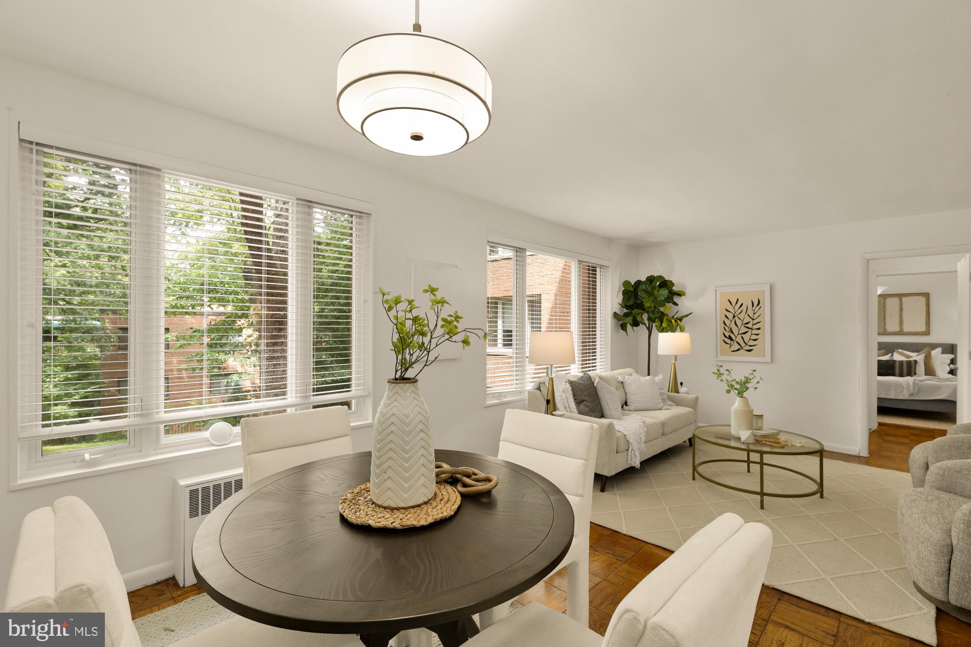 2400 41st Street Northwest, Unit 212 Washington, DC 20007 - Photo 8 of 24 a living room with furniture and a table