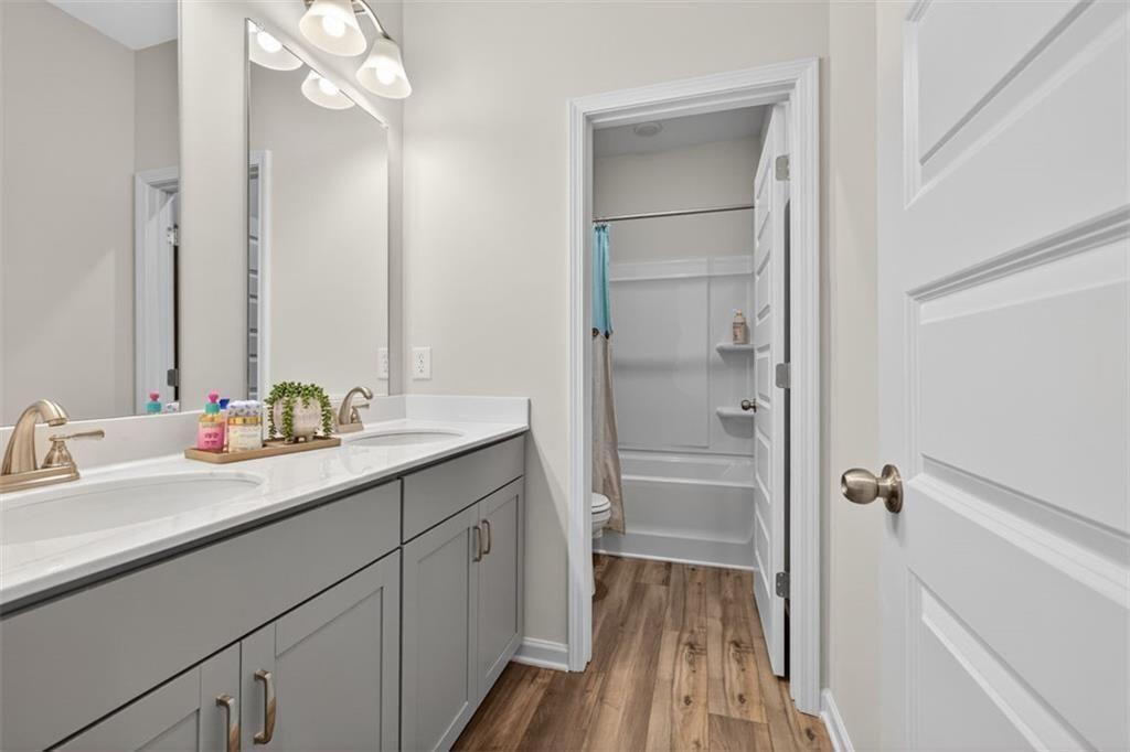 17 North Haven Drive Rome, GA 30165 - Photo 25 of 41 a bathroom with a double vanity sink a mirror and a shower
