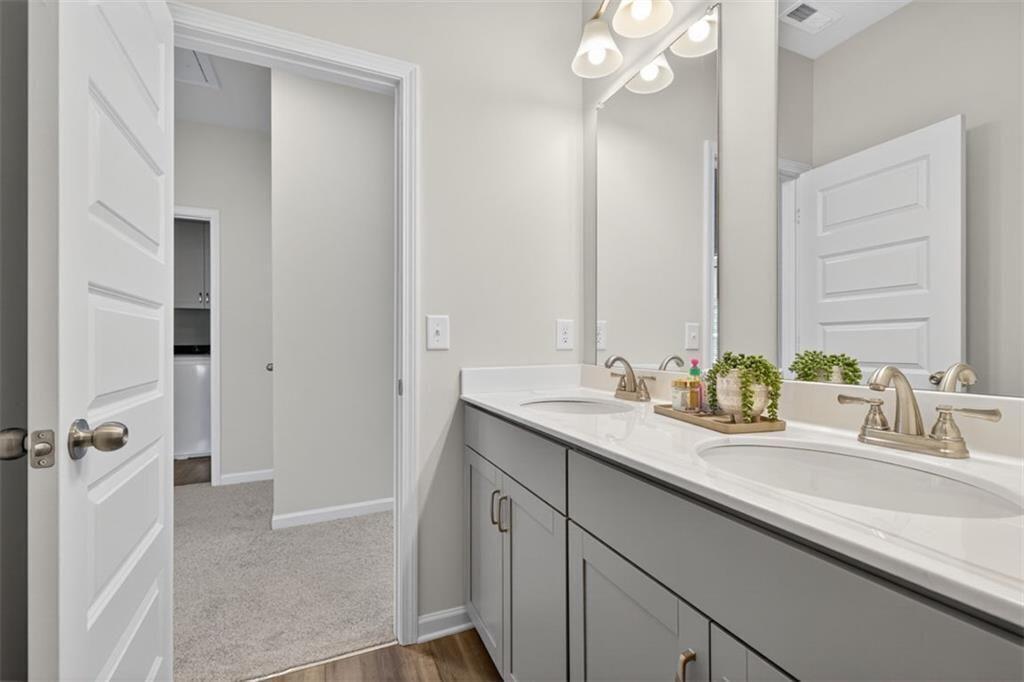17 North Haven Drive Rome, GA 30165 - Photo 26 of 41 a bathroom with a sink double vanity granite tub shower and a mirror