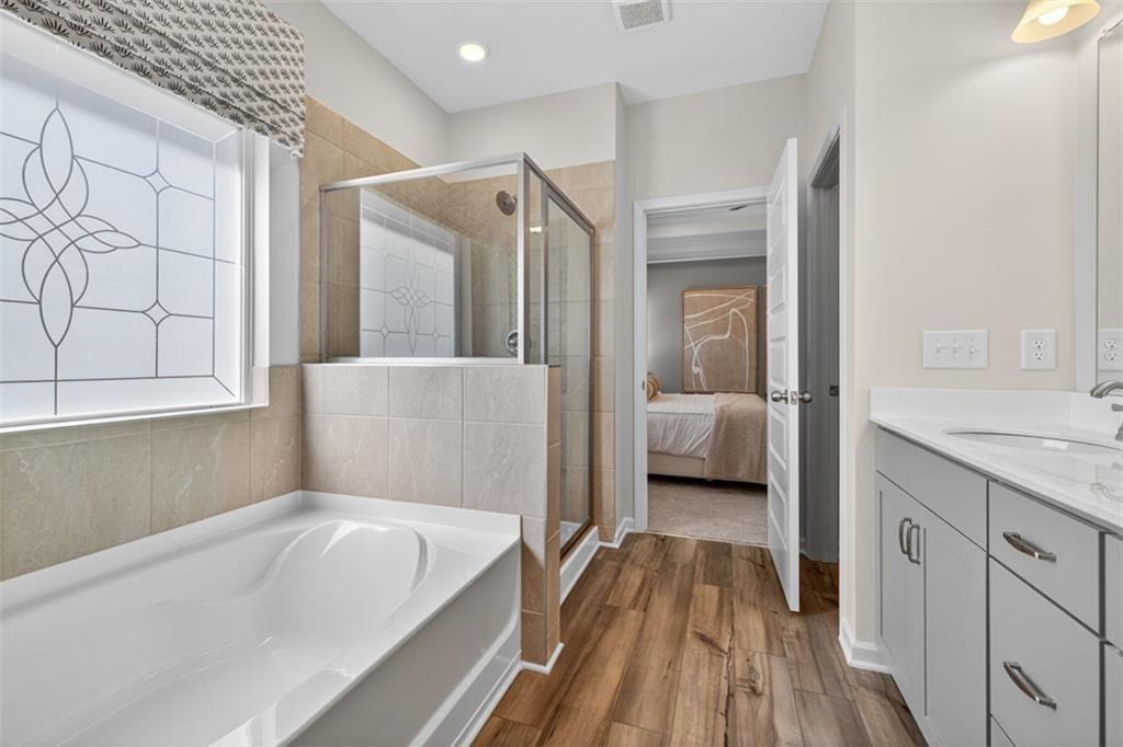 17 North Haven Drive Rome, GA 30165 - Photo 41 of 41 a en suite bathroom with a tub shower and sink