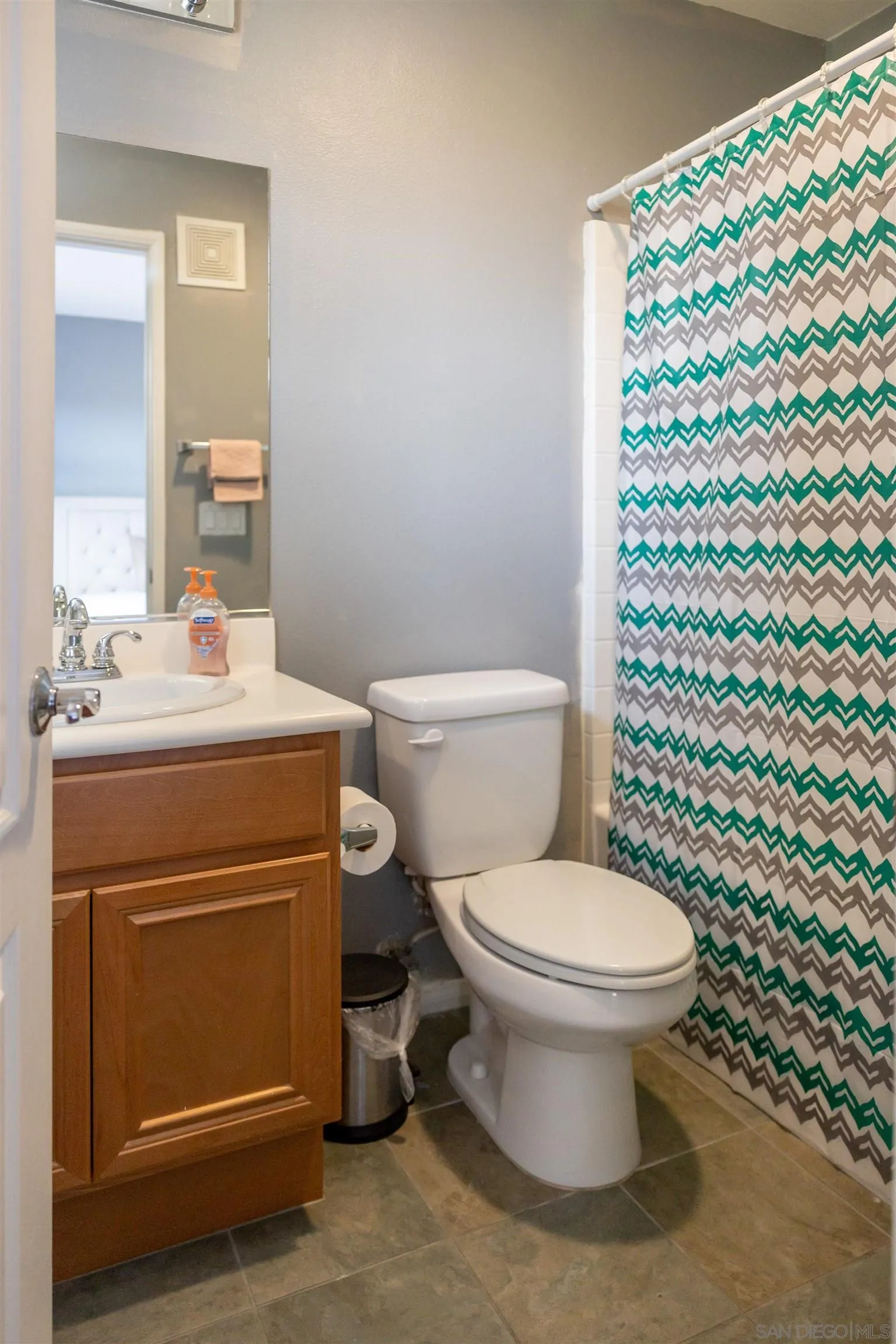 30 Via Sovana Santee, CA 92071 - Photo 11 of 23 a bathroom with a sink toilet and a mirror