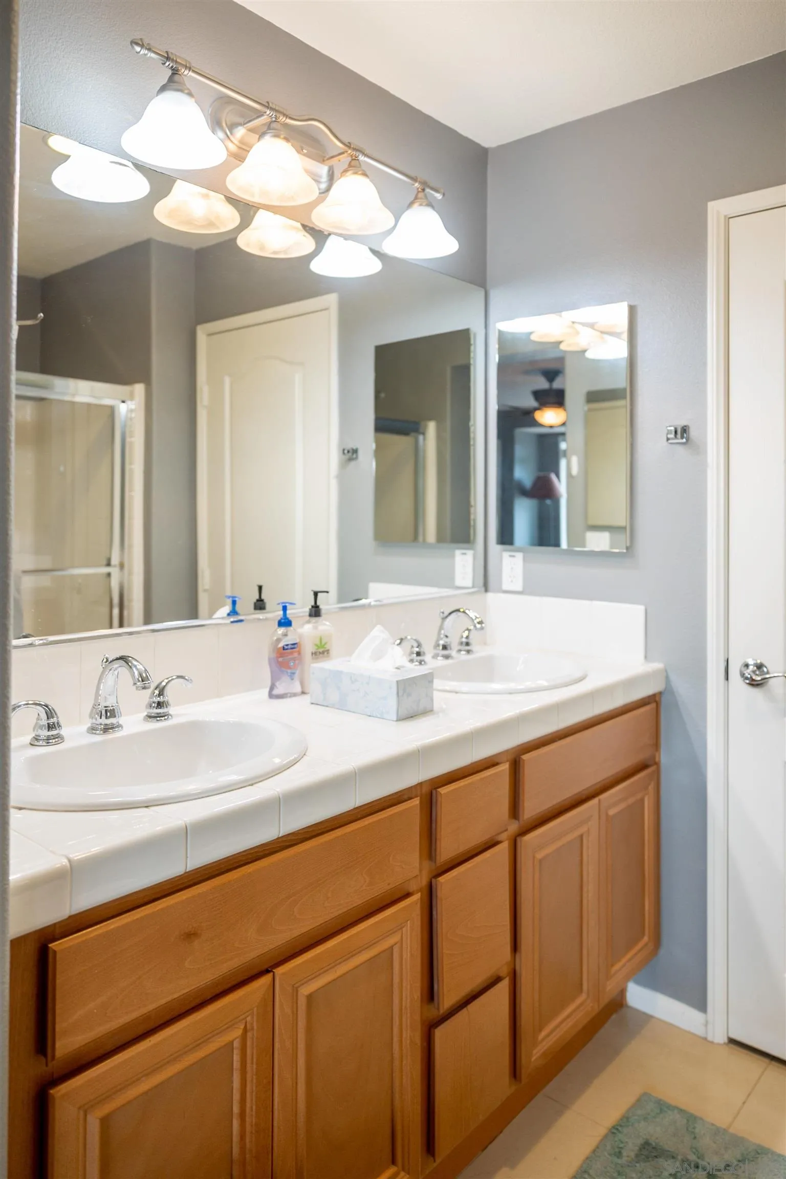 30 Via Sovana Santee, CA 92071 - Photo 15 of 23 a bathroom with a double vanity sink and a mirror
