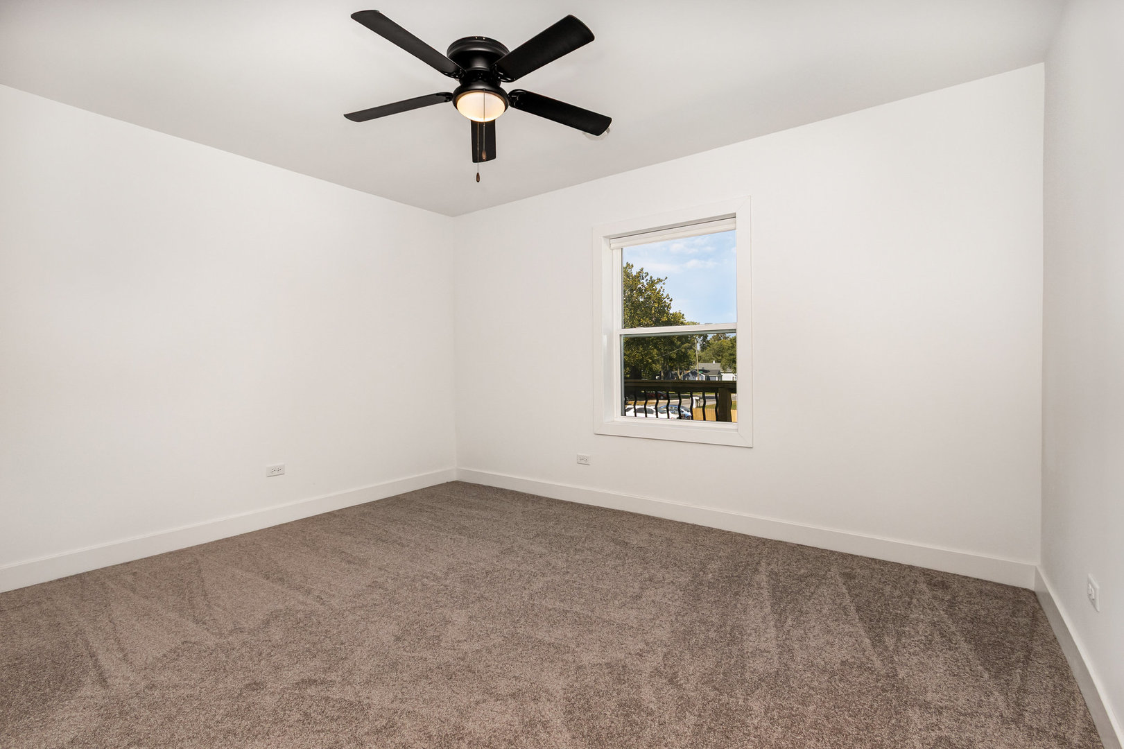 25365 South Fryer Street, Unit 1 Channahon, IL 60410 - Photo 11 of 15 an empty room with a window and a fan