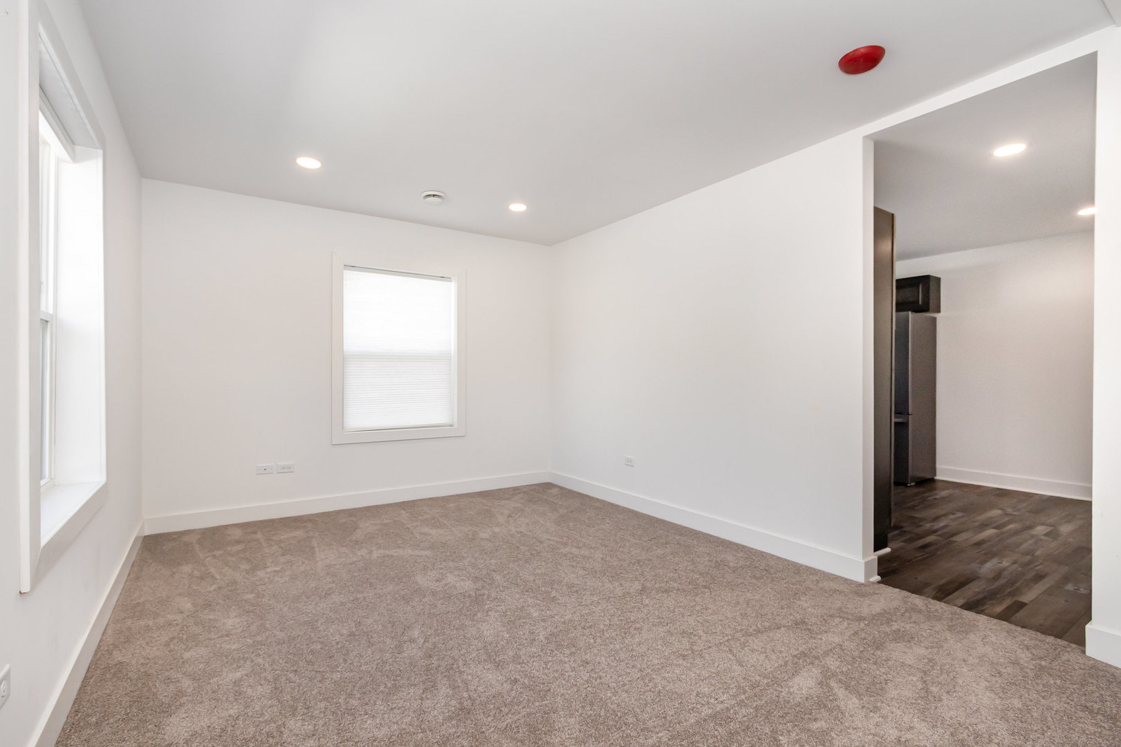 25365 South Fryer Street, Unit 1 Channahon, IL 60410 - Photo 2 of 15 a view of an empty room with a window