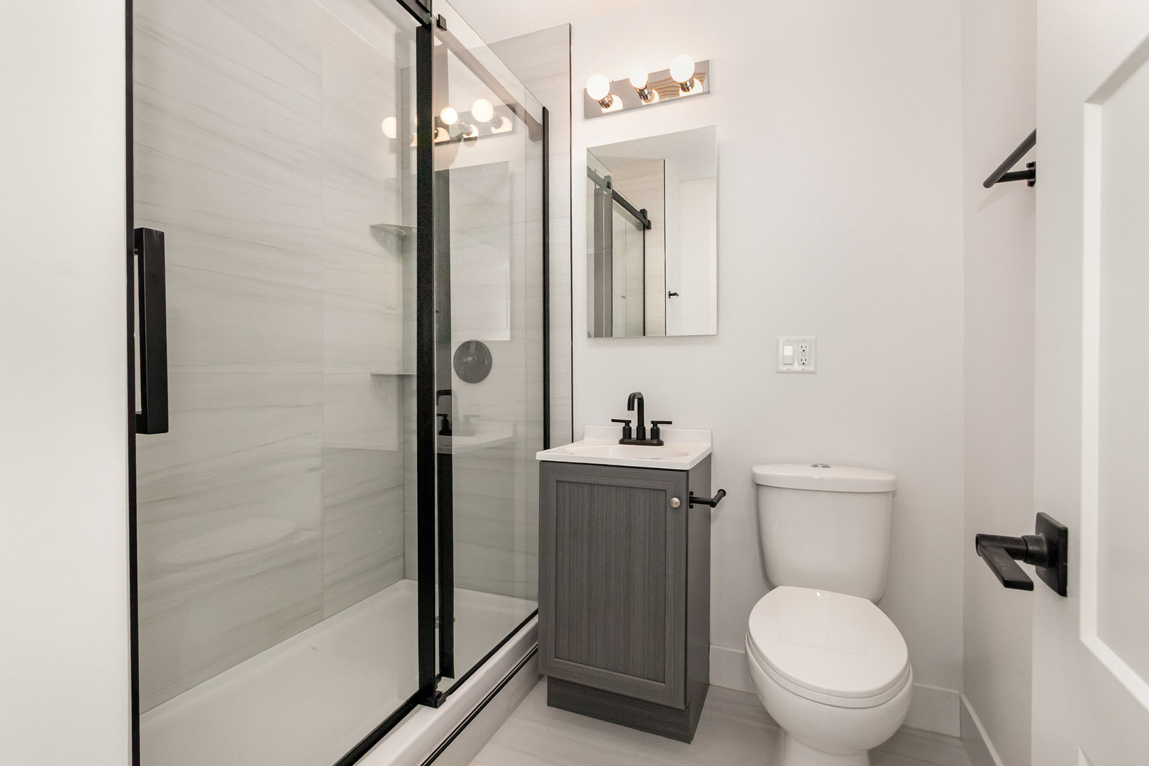 25365 South Fryer Street, Unit 1 Channahon, IL 60410 - Photo 9 of 15 a bathroom with a toilet a sink and shower