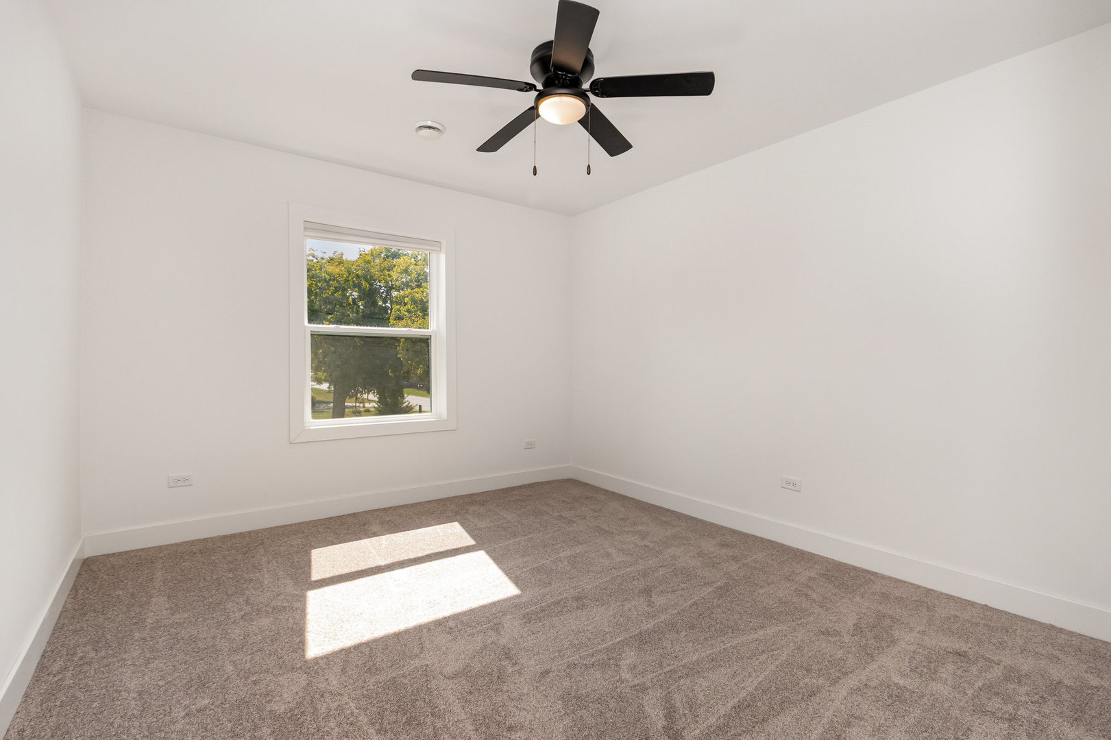 25365 South Fryer Street, Unit 1 Channahon, IL 60410 - Photo 10 of 15 an empty room with windows and fan