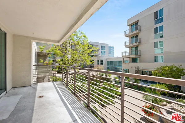 a view of balcony with wooden floor