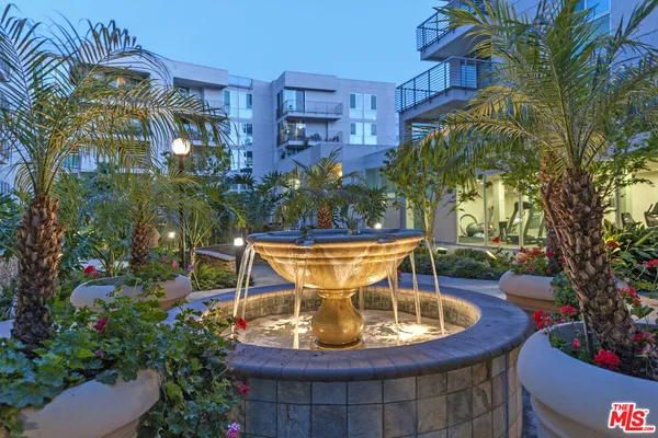 a view of a swimming pool with sitting area