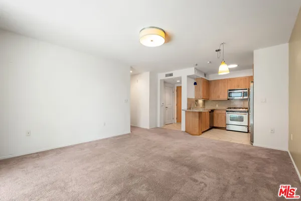 a view of a kitchen with a sink and cabinet area