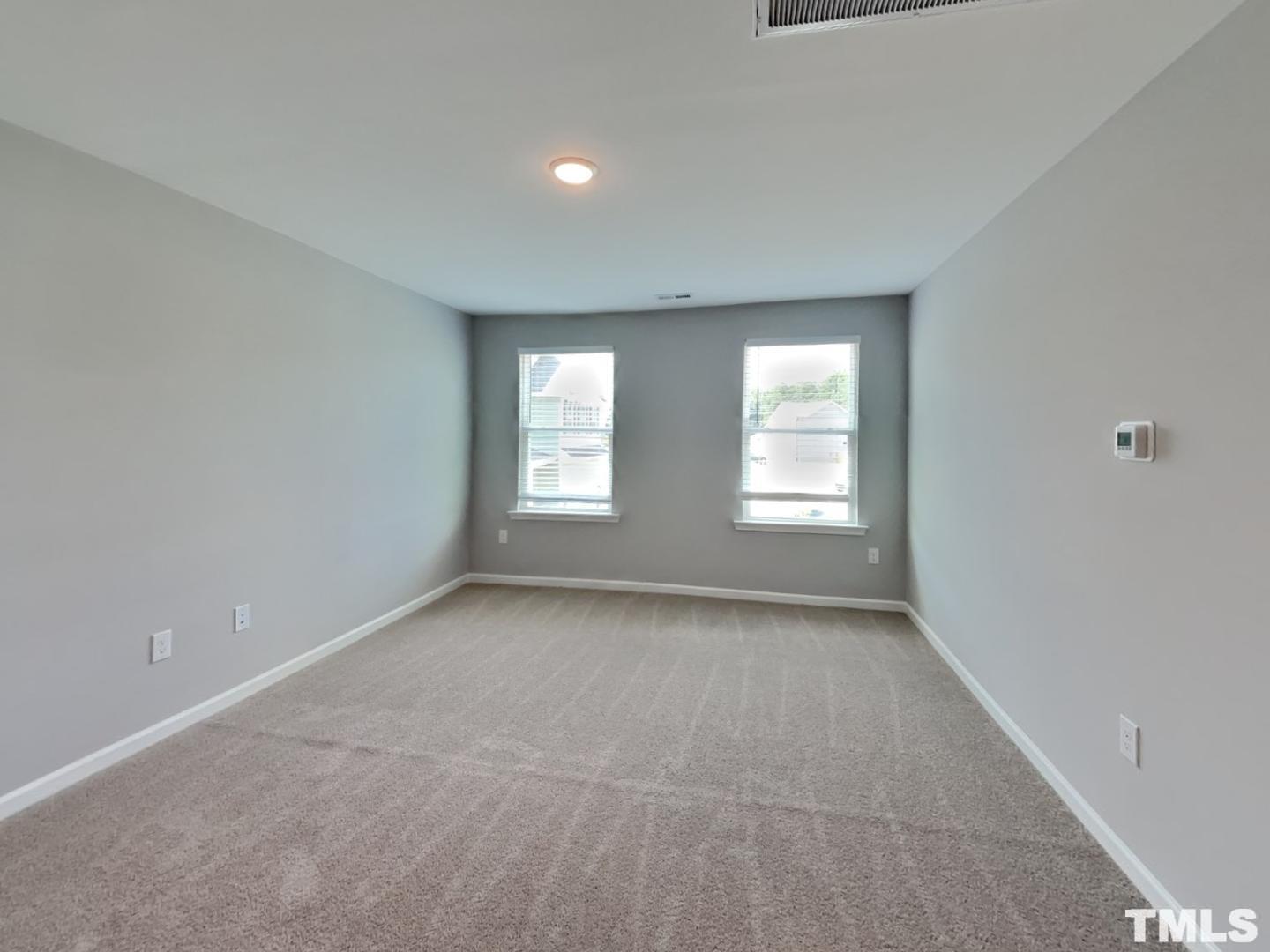 295 Avery Meadows Drive Smithfield, NC 27577 - Photo 14 of 15 a view of an empty room with a window