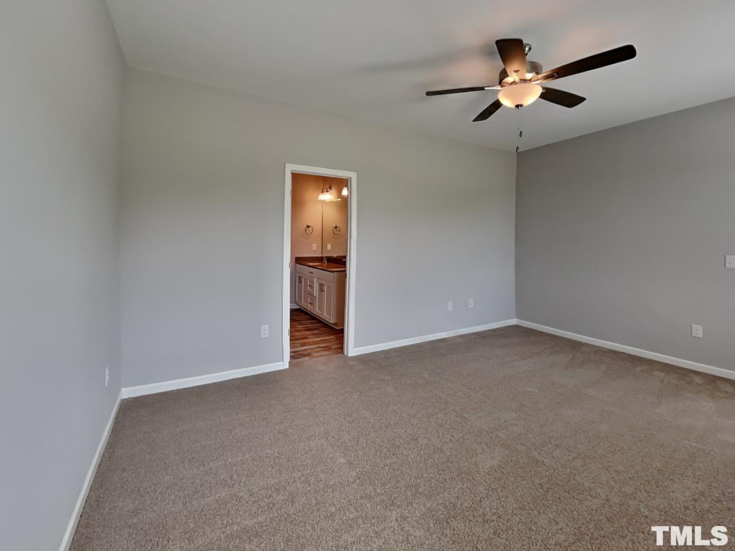 295 Avery Meadows Drive Smithfield, NC 27577 - Photo 7 of 15 a view of empty room with ceiling fan