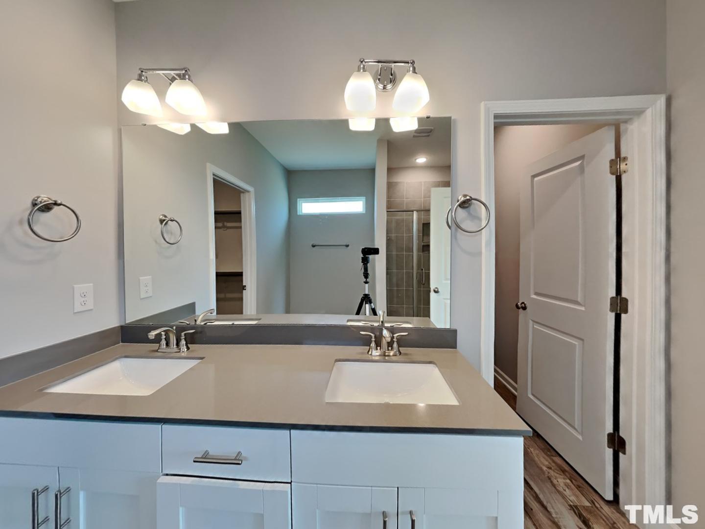 295 Avery Meadows Drive Smithfield, NC 27577 - Photo 8 of 15 a bathroom with a sink double vanity and a mirror