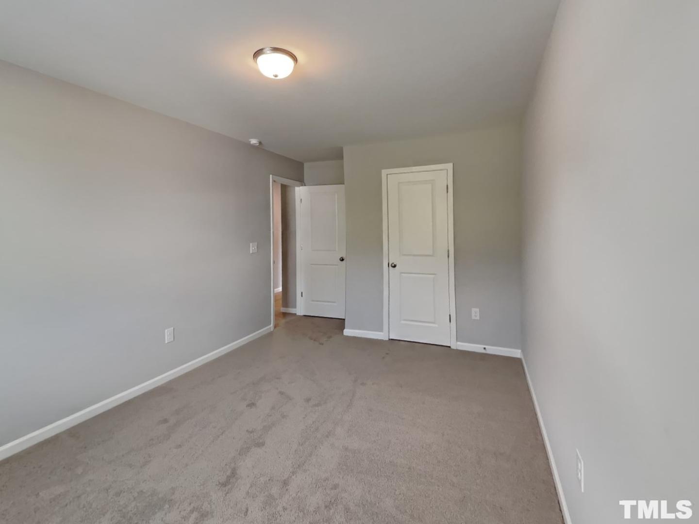 295 Avery Meadows Drive Smithfield, NC 27577 - Photo 10 of 15 an empty room with closet area