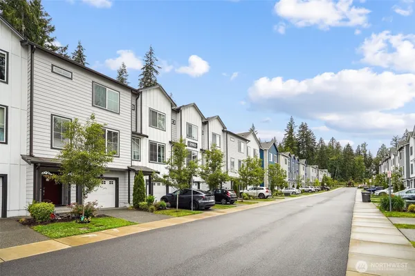 a view of a street with houses on both side
