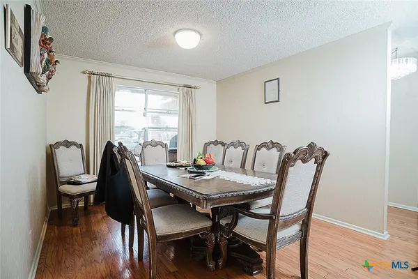 a utility room with cabinets washer and dryer